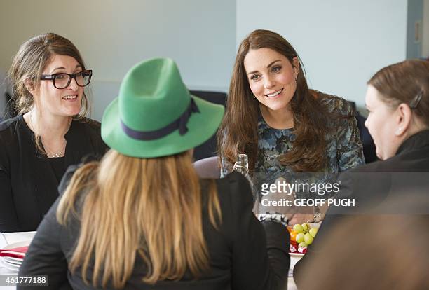 Brtiain's Catherine, Duchess of Cambridge , attends a coffee morning at Family Friends, a voluntary organisation providing mentoring services to...
