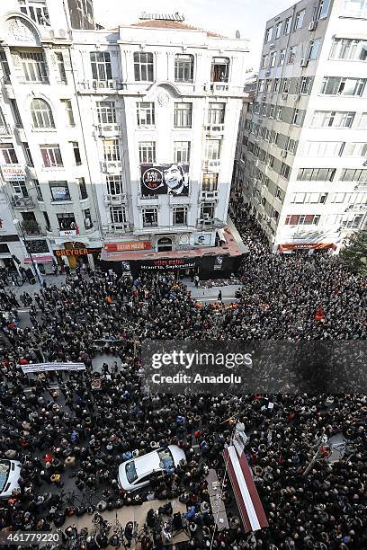 People hold banners and posters during a commemoration ceremony following a march on the 8th death anniversary of Hrant Dink, former editor-in-chief...