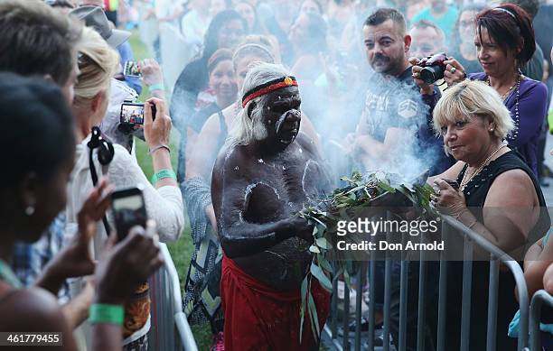 An Aboriginal elder performs a smoking ceremony prior to Chaka Khan's live performance at Sydney Festival 2014 at The Domain on January 11, 2014 in...