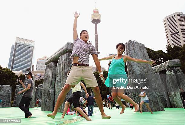 Man and a woman are seen on a Stonehenge shaped jumping castle in Hyde Park as part of Sydney Festival 2014 on January 11, 2014 in Sydney, Australia.