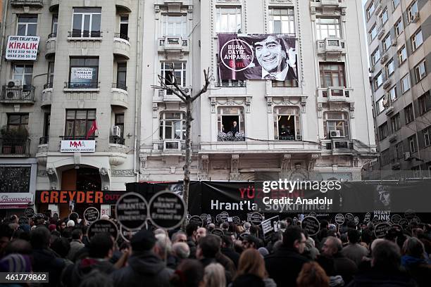 People hold banners and posters during a commemoration ceremony following a march on the 8th death anniversary of Hrant Dink, former editor-in-chief...