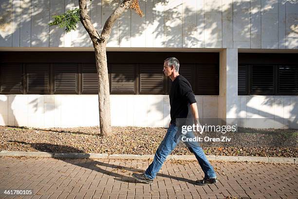 Gilad Sharon, the son of former PM Ariel Sharon, walks at Tel Hashomer hospital after the hospital announced the death of Ariel Sharon on January 11,...