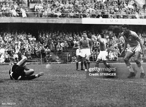 Brazilian Vava scores a goal as French goalkeeper Claude Abbes tries to stop the ball, on June 24, 1958 during the semifinal World Cup, at the...