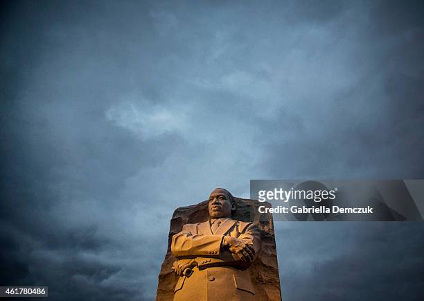 Early morning light shines on the Martin Luther King Jr. Memorial on the National Mall on January 19, 2015 in Washington, D.C. Visitors gather at the...