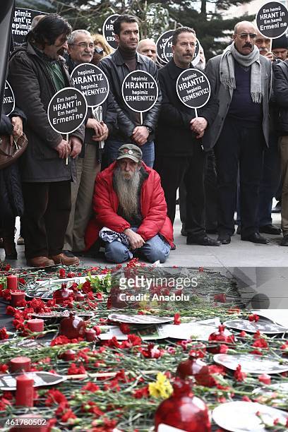 Carnations and candles are seen during a commemoration ceremony following a march on the 8th death anniversary of Hrant Dink, former editor-in-chief...