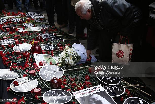 Carnations and candles are seen during a commemoration ceremony following a march on the 8th death anniversary of Hrant Dink, former editor-in-chief...