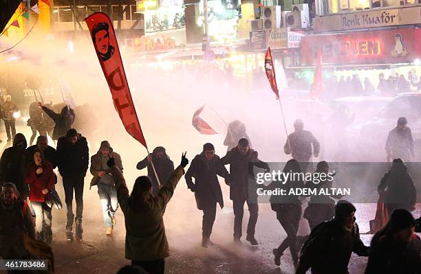 Turkish police use water cannons and tear gas to disperse demonstrators of walking to Kizilay Square in Ankara for mark the 8th anniversary of Hrant...