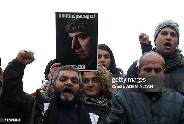 People take part in a demonstration calling for justice over the murder of Turkish-Armenian journalist Hrant Dink on January 19, 2015 in Ankara. Dink...