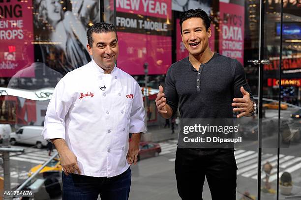 Mario Lopez interviews Buddy Valastro during his visit to "Extra" at their New York studios at H&M in Times Square on January 19, 2015 in New York...