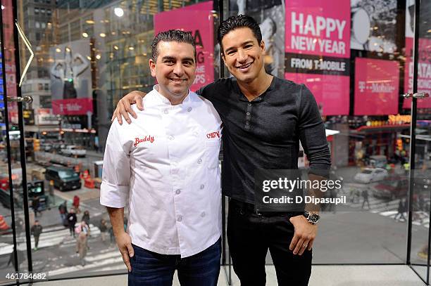Mario Lopez interviews Buddy Valastro during his visit to "Extra" at their New York studios at H&M in Times Square on January 19, 2015 in New York...