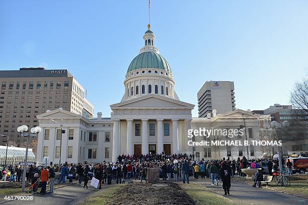Protesters demonstrate against racism in the "Reclaim MLK" march January 19, 2015 in front of the old courthouse building in Downtown St. Louis,...