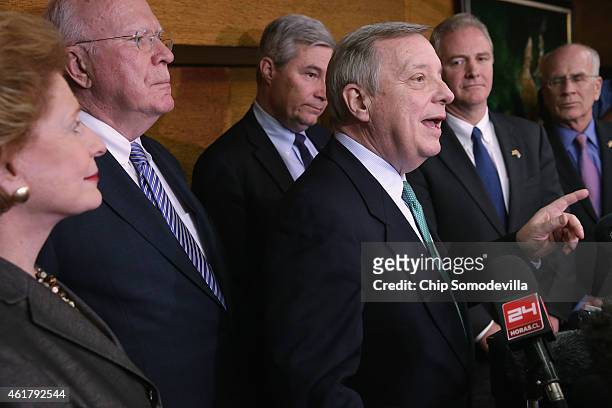 Sen. Richard Durbin answers questions from reporters during a news conference with Sen. Debbie Stabenow , Sen. Patrick Leahy , Sen. Sheldon...
