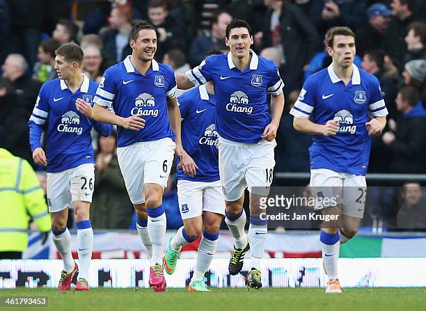 Gareth Barry of Everton celebrates his goal with Phil Jagielka during the Barclays Premier League match between Everton and Norwich City at Goodison...