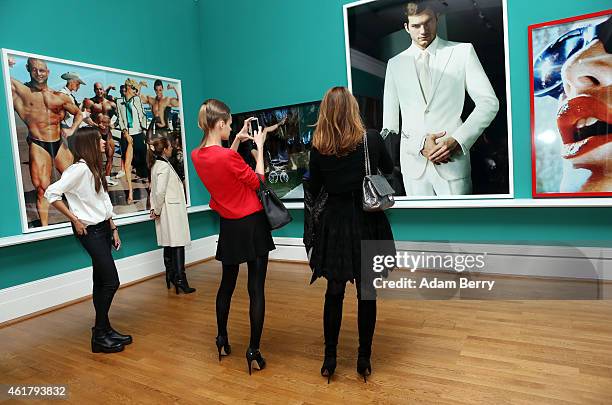 Visitors attend the 'Mario Testino: In Your Face' private view vernissage at Kunstbibliothek on January 19, 2015 in Berlin, Germany.