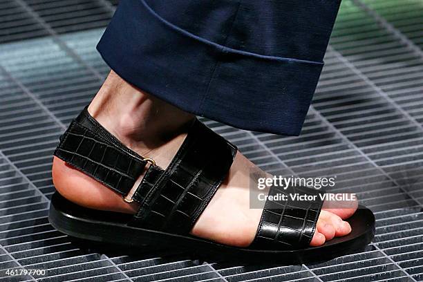 Model walks the runway during the Gucci show as part of Milan Menswear Fashion Week Fall Winter 2015/2016 on January 19, 2015 in Milan, Italy.