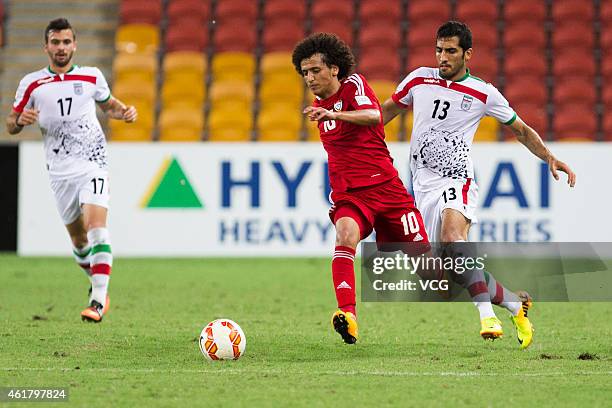 Omar Abdulrahman of the United Arab Emirates and Vahid Amiri of Iran challenge for the ball during the 2015 Asian Cup match between IR Iran and the...