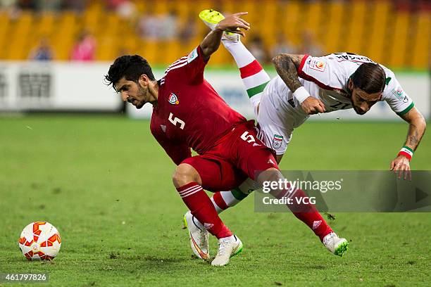 Amer Abdulrahman of the United Arab Emirates and Ashkan Dejagah of Iran challenge for the ball during the 2015 Asian Cup match between IR Iran and...