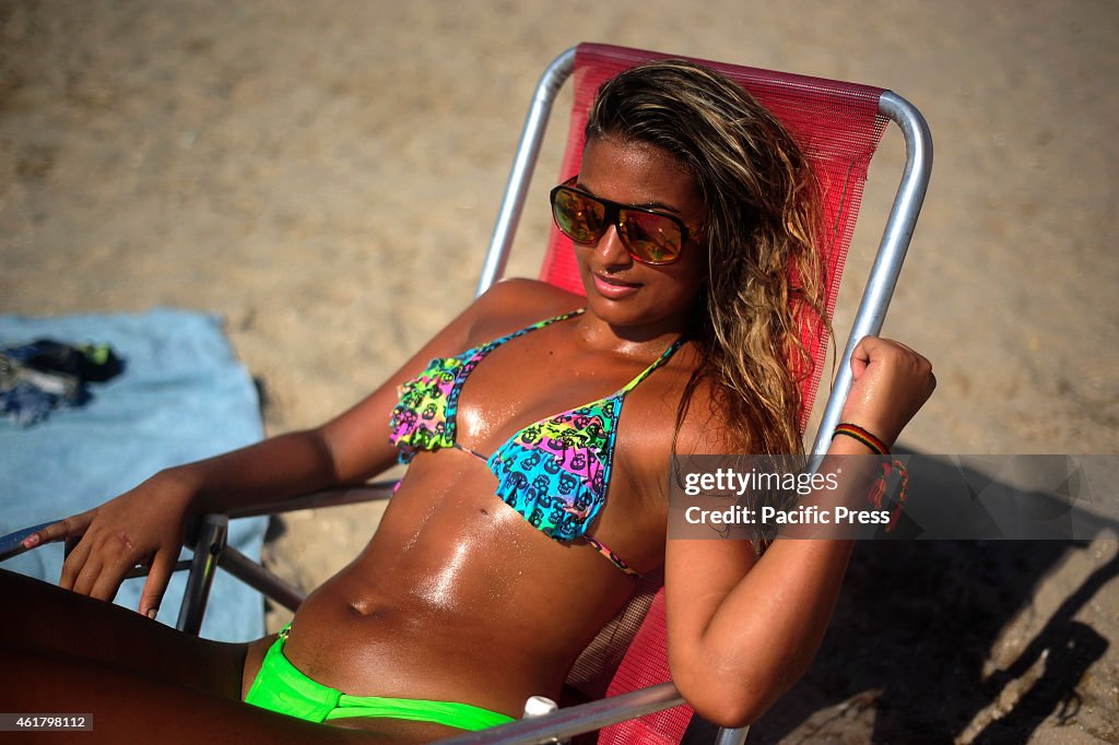 Beach goers enjoy  the waters of  Palm Piscinão, north of...