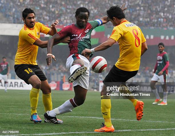 Odafa Okolie of Mohunbagan is being blocked by Gurwinder Singh and Naoba Sing of East Bengal during the Premier Division League Derby Match at Yuba...