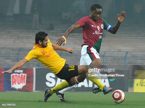 Odafa Okolie of Mohunbagan is being blocked by Gurwinder Singh of East Bengal during the Premier Division League Derby Match at Yuba Bharati...