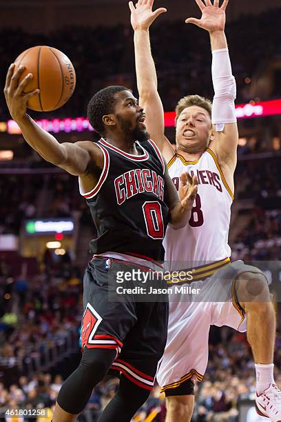 Aaron Brooks of the Chicago Bulls shoots over Matthew Dellavedova of the Cleveland Cavaliers during the first half at Quicken Loans Arena on January...