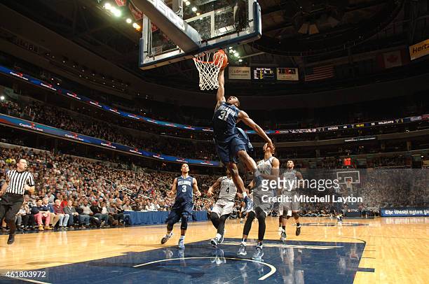 Dylan Ennis of the Villanova Wildcats dunks the basketball during a college basketball game against the Georgetown Hoyas at the Verizon Center on...
