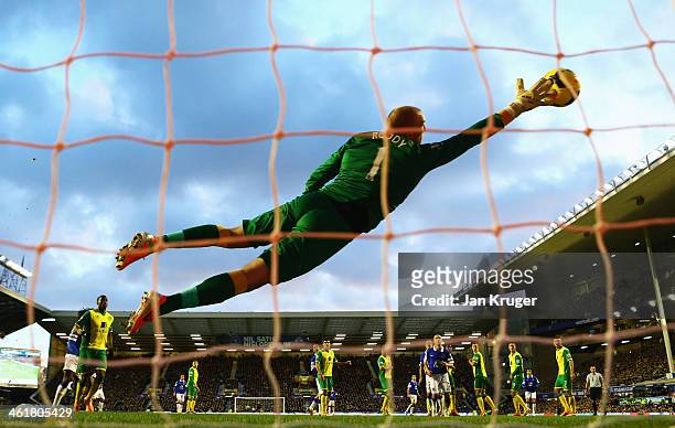 John Ruddy of Norwich City fails to stop the free kick by Kevin Mirallas of Everton during the Barclays Premier League match between Everton and...