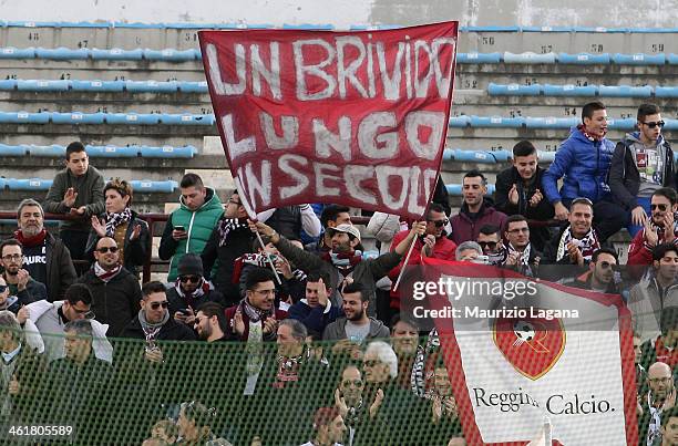 Reggina supporter holds a banner aloft during celebra`tions to mark the club's 100th Anniversary at Oreste Granillo Stadium on January 11, 2014 in...