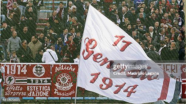 Reggina supporter waves a flag during celebrations for the club's 100th Anniversary at Oreste Granillo Stadium on January 11, 2014 in Reggio...