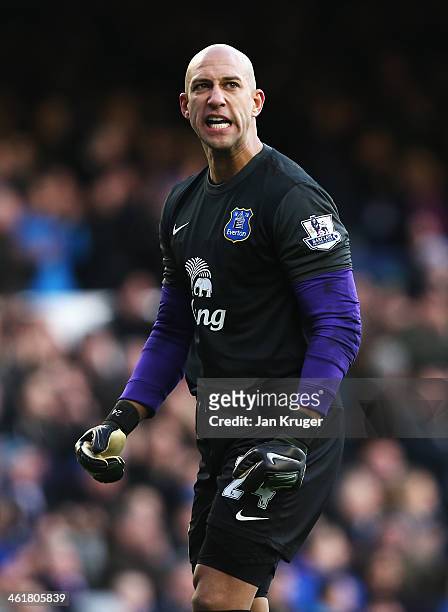 Goalkeeper Tim Howard of Everton celebrates the opening goal by Gareth Barry during the Barclays Premier League match between Everton and Norwich...