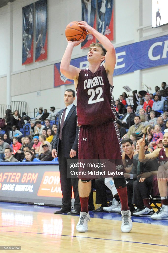 Matthew Colgate Matt McMullen of the Colgate Raiders takes a jump shot during a... News ...