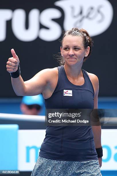 Casey Dellacqua of Australia celebrates winning her first round match against Yvonne Meusburger of Austria during day two of the 2015 Australian Open...