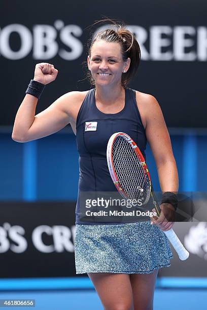 Casey Dellacqua of Australia celebrates winning her first round match against Yvonne Meusburger of Austria during day two of the 2015 Australian Open...