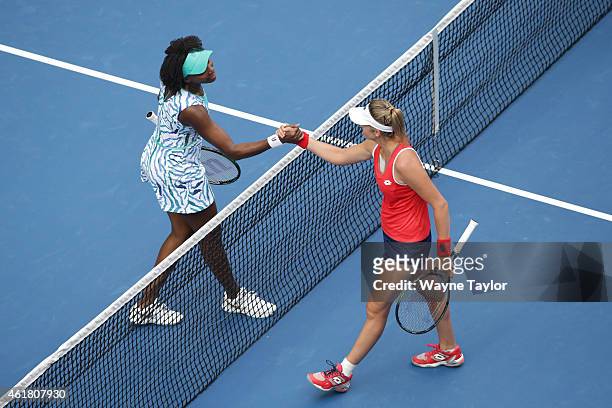 Venus Williams of the United States shakes hands after winning her first round match against Maria-Teresa Torro-Flor of Spain during day two of the...