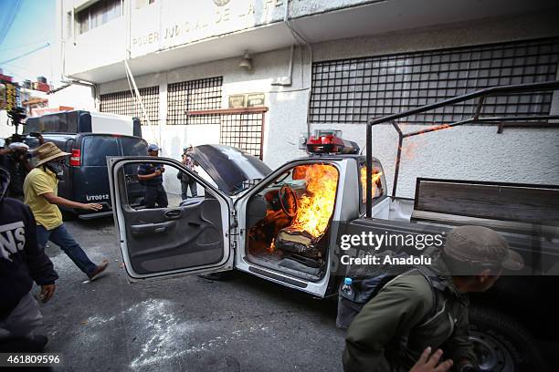 Police truck burns in flames during a protest in demand of justice and clarification for the disappearance of 43 students from Ayotzinapa, in...