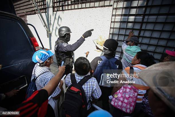 Demonstrators clash with police during a protest in demand of justice and clarification for the disappearance of 43 students from Ayotzinapa, in...