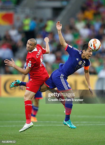 Odai Al Saify of Jordan and Makoto Hasebe of Japan compete for the ball during the 2015 Asian Cup match between Japan and Jordan at AAMI Park on...