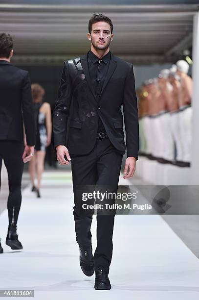 Model walks the runway during the Dirk Bikkembergs as a part of Milan Menswear Fashion Week Fall Winter 2015/2016 on January 20, 2015 in Milan, Italy.