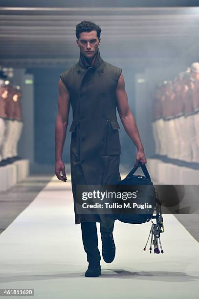 Model walks the runway during the Dirk Bikkembergs as a part of Milan Menswear Fashion Week Fall Winter 2015/2016 on January 20, 2015 in Milan, Italy.