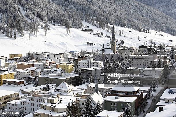 Snow covers the rooftops of residential buildings on the town skyline ahead of the World Economic Forum in Davos, Switzerland, on Monday, Jan. 19,...