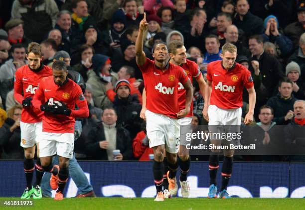 Luis Antonio Valencia of Manchester United celebrates scoring the opening goal during the Barclays Premier League match between Manchester United and...