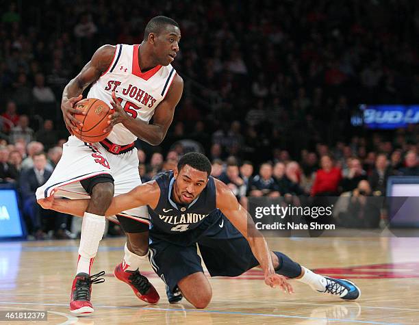 Kris Jenkins of the Villanova Wildcats gets caught as he reaches to guard Ryan Arcidiacono of the St. John's Red Storm during the game at Madison...