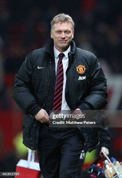 Manager David Moyes of Manchester United walks off after the Barclays Premier League match between Manchester United and Swansea City at Old Trafford...