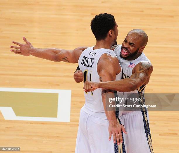 Chris Bolden and Trae Golden of the Georgia Tech Yellow Jackets celebrate after the game against the Notre Dame Fighting Irish at McCamish Pavilion...