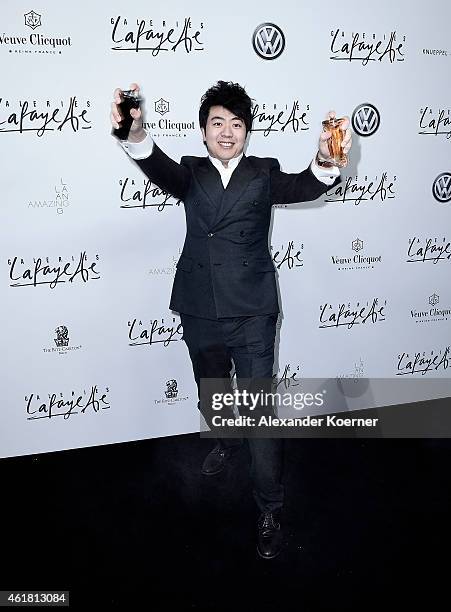 Pianist Lang Lang presents his new fragrence during the 'Amazing Lang Lang' World Premiere Fragrance Launch at Galeries Lafayette on January 19, 2015...