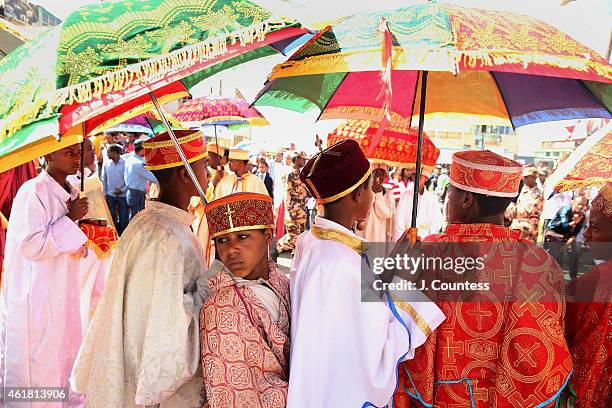 Deacons from the Ethiopian Orthodox Tewahedo Church pause as during the procession of the Tabot through the streets of the Ethiopian city of Gonder...