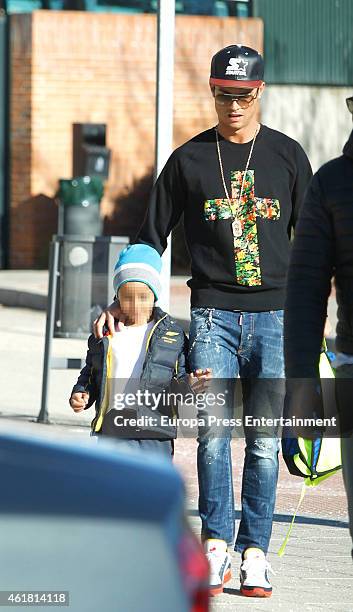 Real Madrid football player Cristiano Ronaldo is seen with his son Cristiano Ronaldo Jr at school on January 19, 2015 in Madrid, Spain.