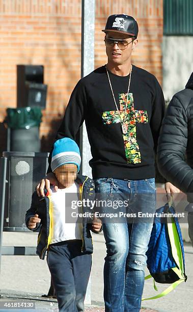 Real Madrid football player Cristiano Ronaldo is seen with his son Cristiano Ronaldo Jr at school on January 19, 2015 in Madrid, Spain.