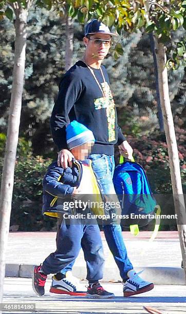 Real Madrid football player Cristiano Ronaldo is seen with his son Cristiano Ronaldo Jr at school on January 19, 2015 in Madrid, Spain.