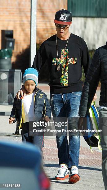 Real Madrid football player Cristiano Ronaldo is seen with his son Cristiano Ronaldo Jr at school on January 19, 2015 in Madrid, Spain.